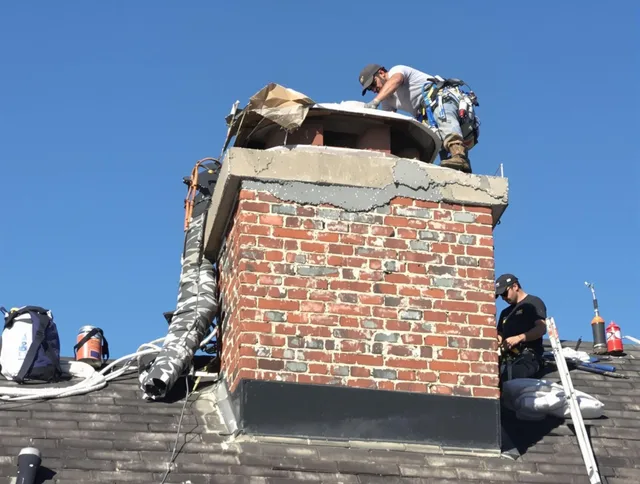 West Haven Chimney Sweep installing a custom chimney crown in West Haven, CT