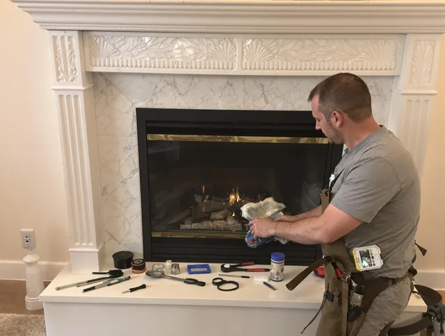 West Haven Chimney Sweep performing fireplace maintenance in West Haven, CT