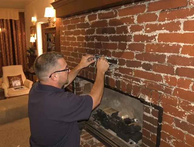 West Haven Chimney Sweep expert fixing a fireplace in West Haven, CT